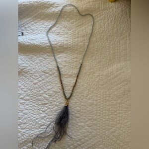 Elegant Gold and Silver Beaded Necklace with Feather Pendant